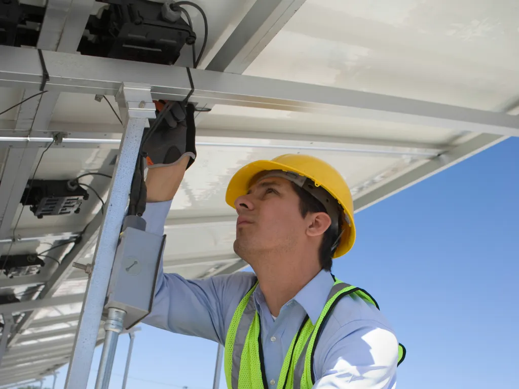 Solar Engineer Checking Solar Panel